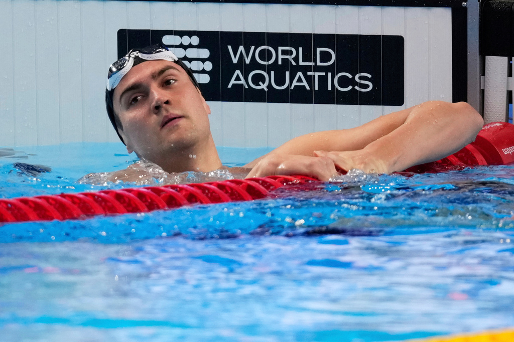 FILE - Neutral Athlete Russia, Kliment Kolesnikov reacts after winning gold medal in the men's 50-meter backstroke final at the World Aquatics Championships in Singapore, on Aug. 3, 2025. (AP Photo/Vincent Thian, File)