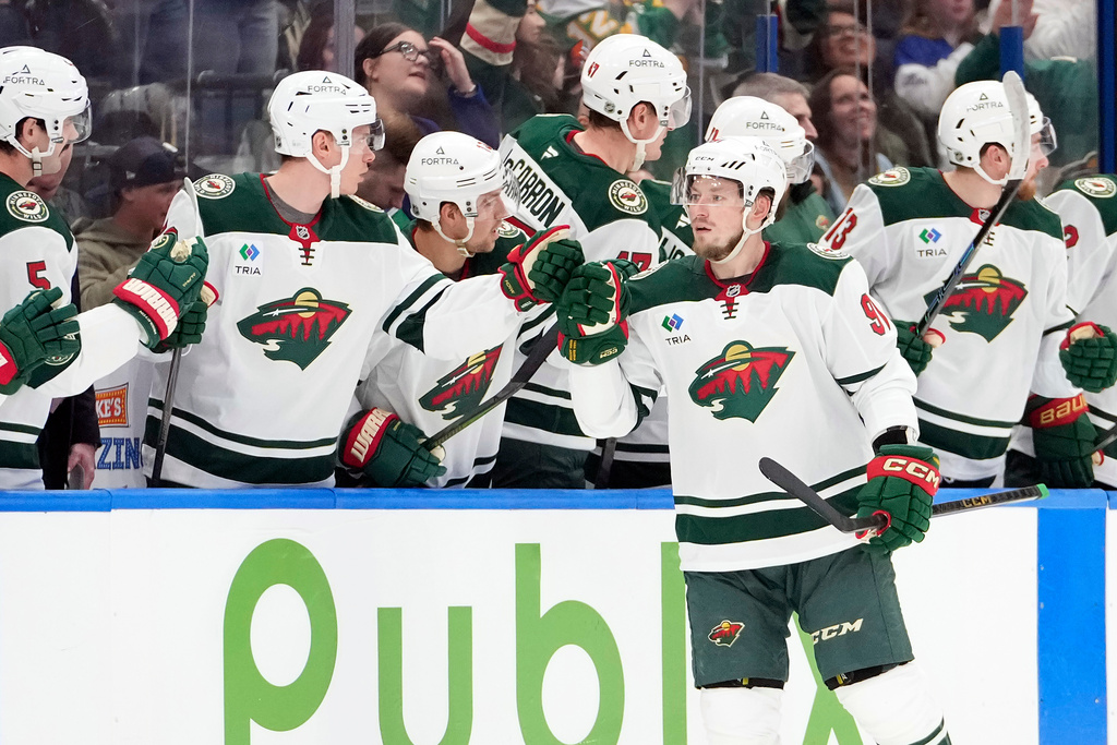 Minnesota Wild right wing Vladimir Tarasenko (91) celebrates with the bench after scoring against the Tampa Bay Lightning during the second period of an NHL hockey game Tuesday, March 24, 2026, in Tampa, Fla. (AP Photo/Chris O'Meara)