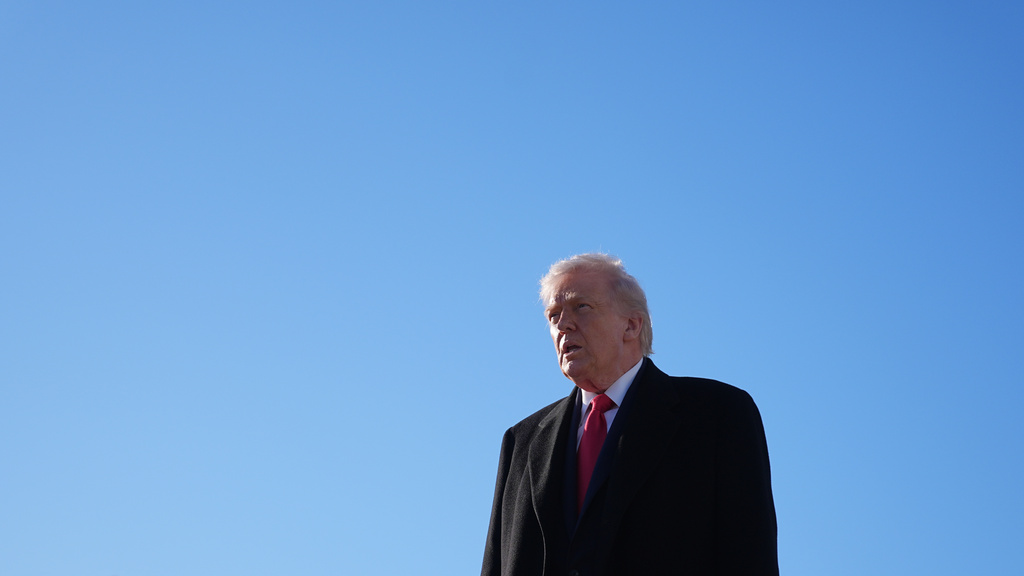 President Donald Trump speaks to reporters before boarding Air Force One at Pope Army Airfield, in Fort Bragg, N.C., Friday, Feb. 13, 2026, en route to Palm Beach, Fla. (AP Photo/Matt Rourke)