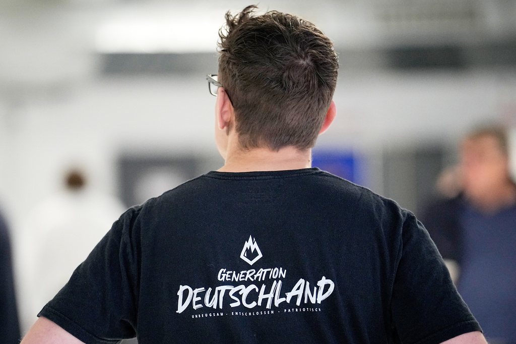 FILE - A party member is pictured during the re-founding of the AfD youth organization as "Generation Deutschland" in Giessen, Germany, Nov. 29, 2025. (AP Photo/Martin Meissner, File)