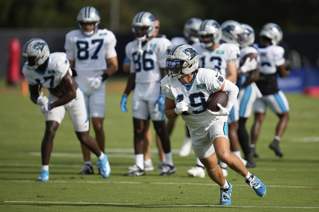 Carolina Panthers wide receiver Adam Thielen (19) runs the ball during a joint NFL football practice with the Houston Texans Thursday, Aug. 14, 2025, in Houston. (AP Photo/Ashley Landis)