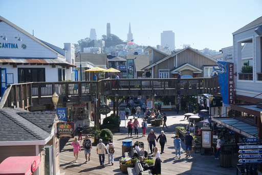 Visitors walk on the boardwalk at Fisherman's Wharf on Tuesday, Oct. 21, 2025, in San Francisco. (AP Photo/Jeff Chiu) Visitors walk on the boardwalk at Fisherman's Wharf on Tuesday, Oct. 21, 2025, in San Francisco. (AP Photo/Jeff Chiu)