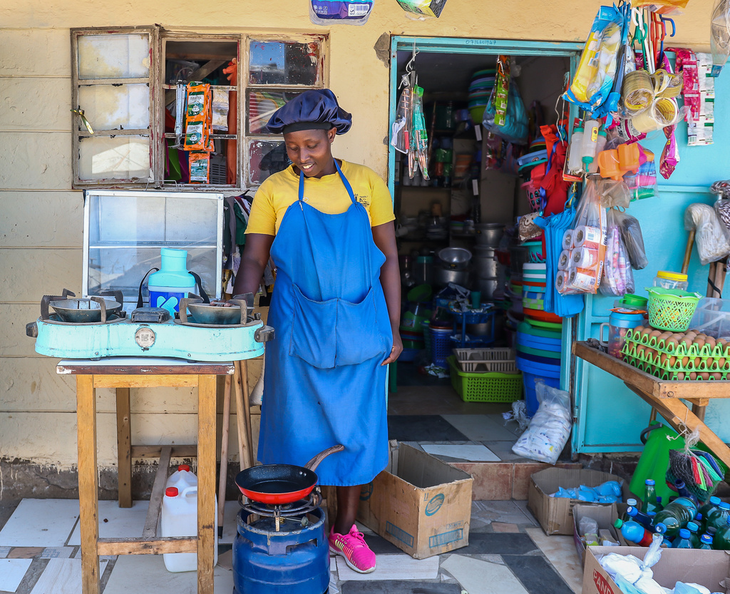 Grace Kathambi uses a KOKO Cooker bioethanol fuel stove to fry and sell French fries at her shop in the Kibera informal settlement on the outskirts of Nairobi, Kenya, Wednesday, Feb. 4, 2026. (AP Photo/Atieno Muyuyi)