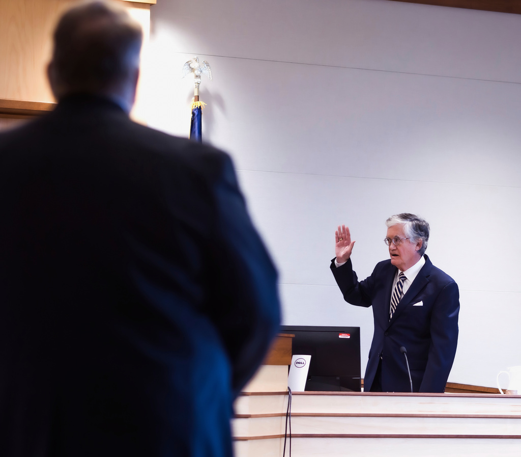John Broderick, former New Hampshire Supreme Court chief justice and former administrator of the YDC Settlement Fund, is sworn in to testify Wednesday, Aug. 20, 2025, in Concord, N.H., in a lawsuit seeking to block changes to the state’s process for compensating those who were abused as children in state custody. (Geoff Forester/The Concord Monitor via AP, Pool)