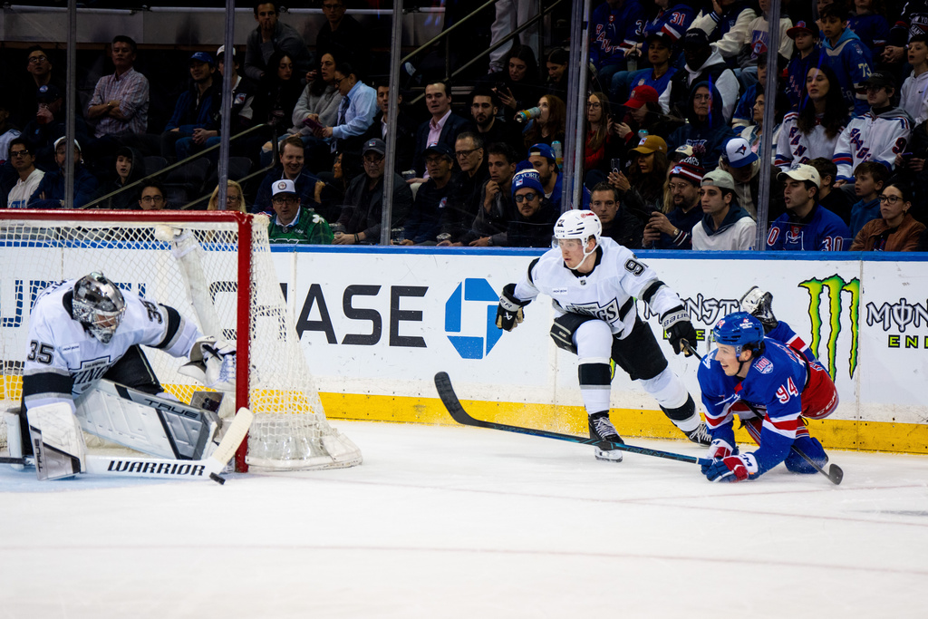 New York Rangers right wing Gabe Perreault (94) shoots during the first period of an NHL hockey game against the Los Angeles Kings, Monday, March 16, 2026, in New York. (AP Photo/Angelina Katsanis)