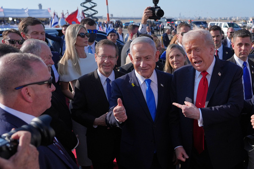 President Donald Trump poses for a photo with Israel's Prime Minister Benjamin Netanyahu before he boards Air Force One at Ben Gurion International Airport, Monday, Oct. 13, 2025, near Tel Aviv, as Israel's President Isaac Herzog, left, watches. (AP Photo/Evan Vucci) President Donald Trump poses for a photo with Israel's Prime Minister Benjamin Netanyahu before he boards Air Force One at Ben Gurion International Airport, Monday, Oct. 13, 2025, near Tel Aviv, as Israel's President Isaac Herzog, left, watches. (AP Photo/Evan Vucci)