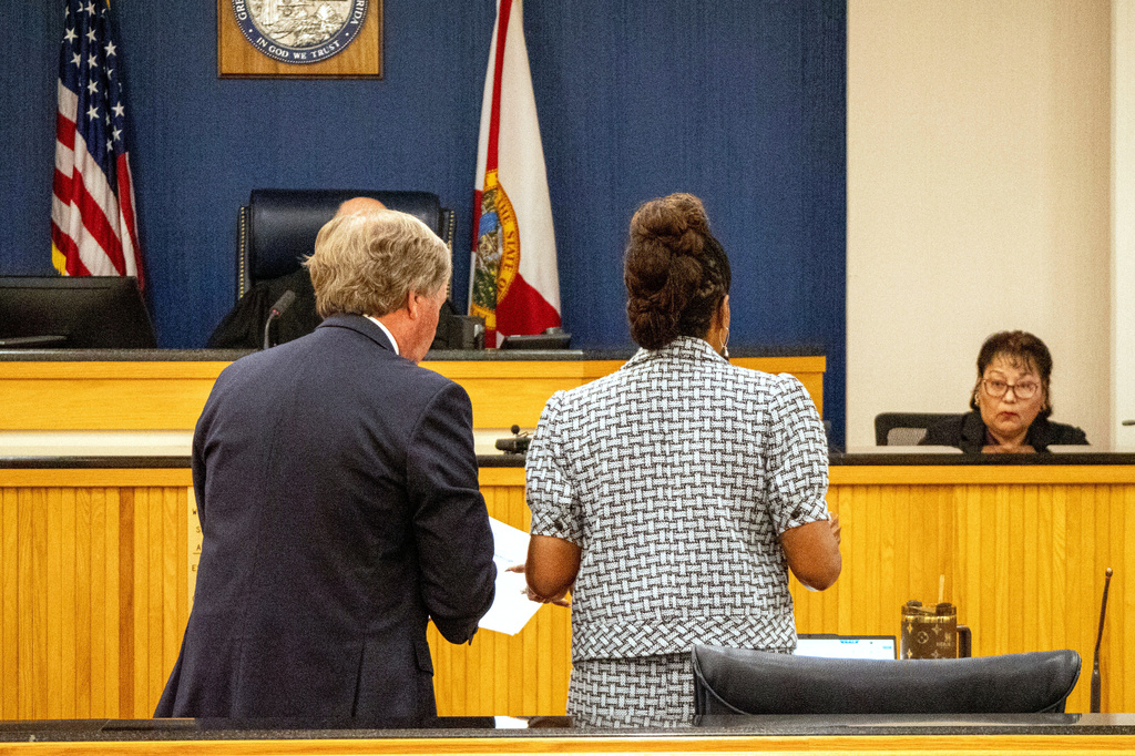 Tiger Woods' defense attorney Doug Duncan and Assistant State Attorney Nirlaine Tallandier Smartt speak during a hearing in Martin County circuit court Tuesday, May 12, 2026,in Stuart, Fla. (Christopher Beckett/New York Post via AP)