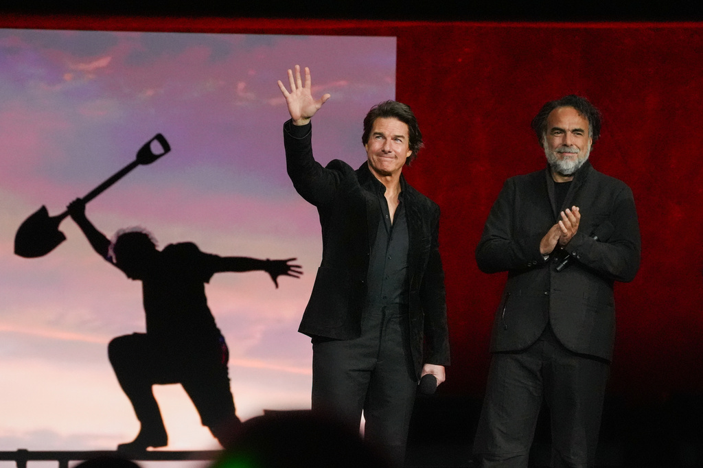 Cast member Tom Cruise, left, and director Alejandro González Iñárritu of the upcoming film "Digger" speak at the Warner Bros. presentation at CinemaCon on Tuesday, April 14, 2026, at Caesars Palace in Las Vegas. (AP Photo/Chris Pizzello)