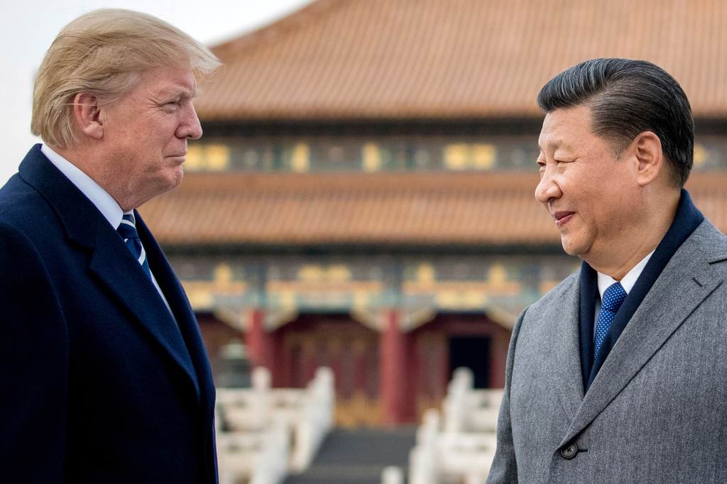 FILE - President Donald Trump, left, and Chinese President Xi Jinping tour the Forbidden City, Nov. 8, 2017, in Beijing, China. (AP Photo/Andrew Harnik, File)