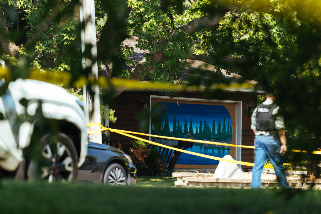 Law enforcement respond to a call at a home daycare, Wednesday, Aug. 12, 2026, in Hopkins, Minn. (AP Photo/Carly Danek)