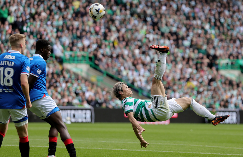 Celtic's Daizen Maeda scores his side's third goal during the Scottish Premiership soccer match between Celtic and Rangers, in Glasgow, Sunday May 10, 2026. (Steve Welsh/PA via AP)