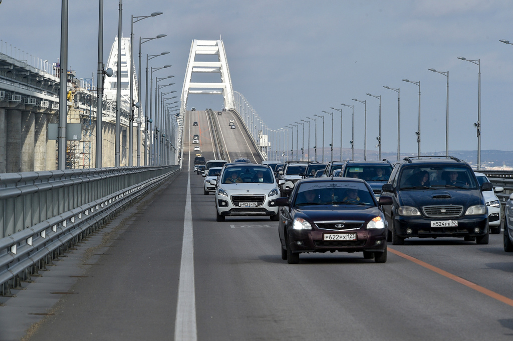FILE - Cars and other vehicles drive on the Kerch Bridge connecting the Russian mainland and the Crimean Peninsula on Thursday, Feb. 23, 2023. (AP Photo, File)