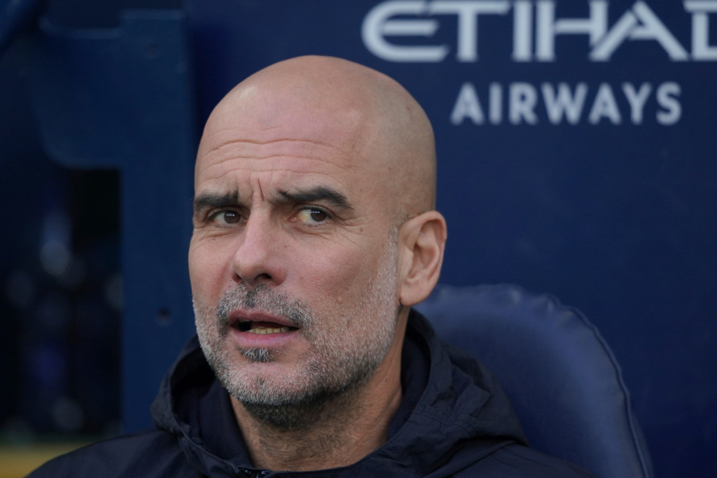 Manchester City's head coach Pep Guardiola on the sidelines ahead of the start of the English Premier League soccer match between Manchester City and Wolverhampton Wanderers in Manchester, England, Saturday, Jan. 24, 2026. (AP Photo/Ian Hodgson)