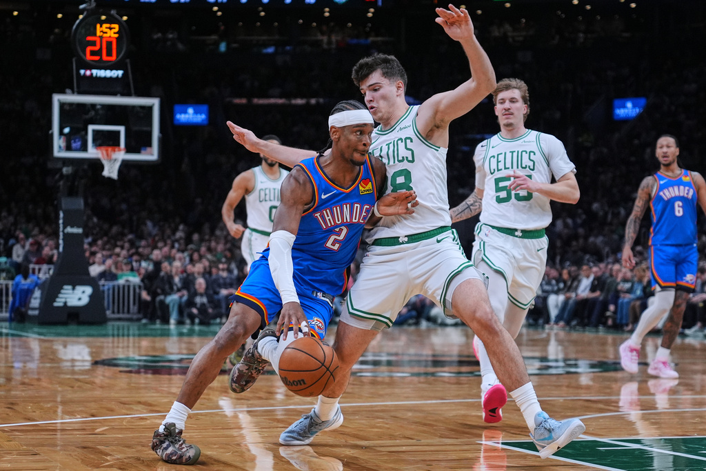 Oklahoma City Thunder guard Shai Gilgeous-Alexander (2) drives to the basket against Boston Celtics guard Hugo Gonzalez (28) during the first half of an NBA basketball game, Wednesday, March 25, 2026, in Boston. (AP Photo/Charles Krupa)
