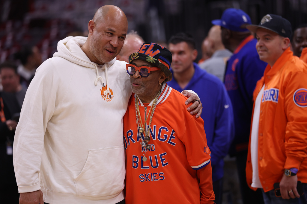 Spike Lee, right, greets Rick Brunson, father of New York Knicks guard Jalen Brunson, before Game 4 in the Eastern Conference finals NBA basketball playoffs series against the Cleveland Cavaliers in Cleveland, Monday, May 25, 2026. (AP Photo/Tim Phillis)