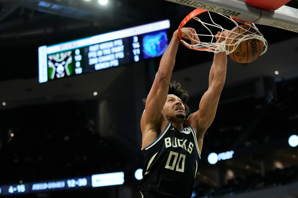 Milwaukee Bucks' Jericho Sims dunks during the first half of an NBA basketball game against the Memphis Grizzlies, Sunday, April 5, 2026, in Milwaukee. (AP Photo/Aaron Gash)