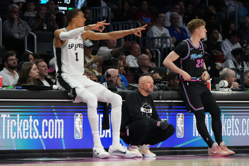 San Antonio Spurs forward Victor Wembanyama (1) reacts during the second half of an NBA basketball game against the Miami Heat, Monday, March 23, 2026, in Miami. (AP Photo/Lynne Sladky)