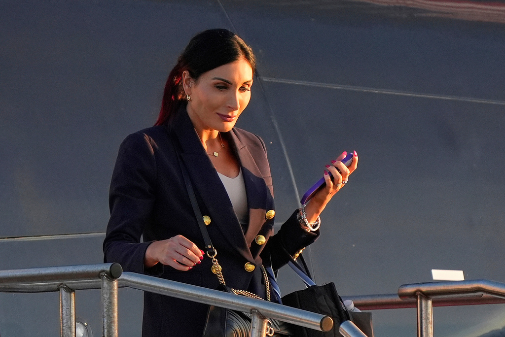 FILE - Laura Loomer arrives at Philadelphia International Airport, Sept. 10, 2024, in Philadelphia. (AP Photo/Chris Szagola, File)