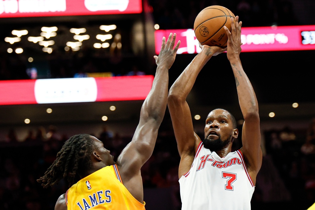 Houston Rockets forward Kevin Durant (7) looks to shoot against Charlotte Hornets guard Sion James, left, during the first half of an NBA basketball game in Charlotte, N.C., Thursday, Feb. 19, 2026. (AP Photo/Nell Redmond)