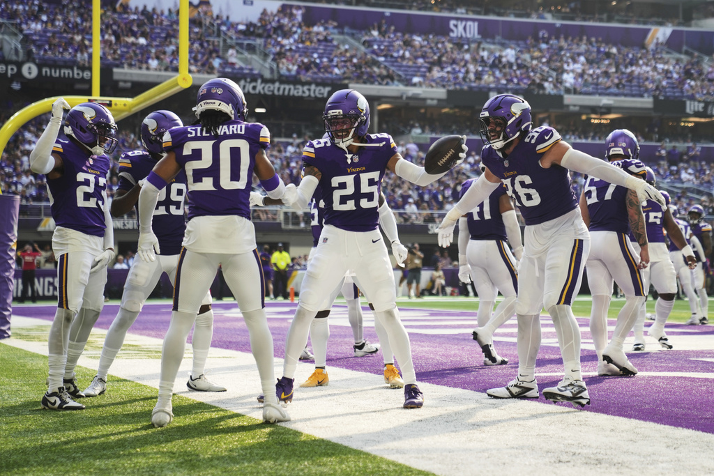 Minnesota Vikings cornerback Kahlef Hailassie (25) celebrates with teammates after an interception during the second half of an NFL preseason football game against the Houston Texans, Saturday, Aug. 9, 2025, in Minneapolis. (AP Photo/Abbie Parr)