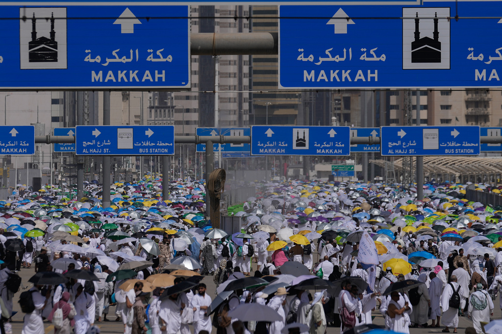 Muslim pilgrims leave after casting pebbles at pillars in the symbolic stoning of the devil, the last rite of the annual Hajj, in Mina near the holy city of Mecca, Saudi Arabia, Wednesday, May 27, 2026. (AP Photo/Altaf Qadri)