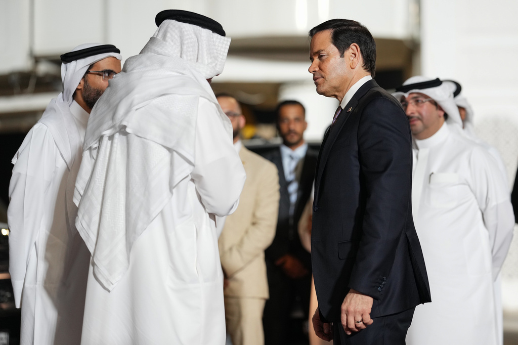 Bahrain's Foreign Minister Abdullatif bin Rashid Al Zayani speaks with U.S. Secretary of State Marco Rubio, right, upon arrival at Bahrain International Airport during his visit to the Middle East to discuss the interim deal between the U.S. and Iran with Arab Gulf allies, in Muharraq, near Manama, Bahrain, Wednesday June 24, 2026. (Eric Lee/Pool Photo via AP)