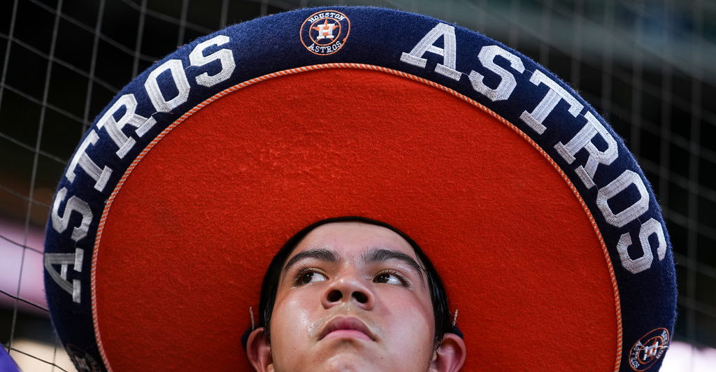 A Houston Astros fan wears large Astros-themed sombrero before a baseball game against the Atlanta Braves in Houston, Sunday, Sept. 20 2026. (Jason Fochtman/Houston Chronicle via AP)