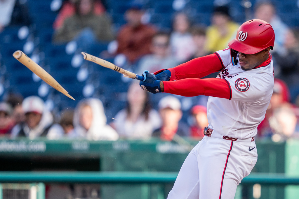 Washington Nationals third baseman José Tena breaks his bat against the St. Louis Cardinals in the fifth inning during a baseball game, Wednesday, April 8, 2026, in Washington. (AP Photo/Nathan Howard)