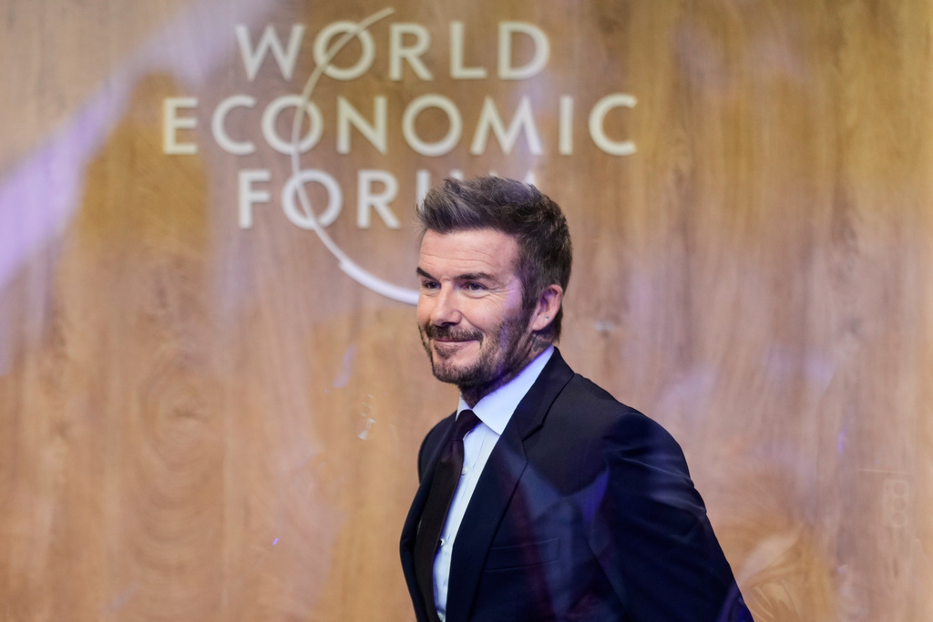 Former soccer player David Beckham leaves after a podcast during of the Annual Meeting of the World Economic Forum in Davos, Switzerland, Tuesday, Jan. 20, 2026. (AP Photo/Markus Schreiber)