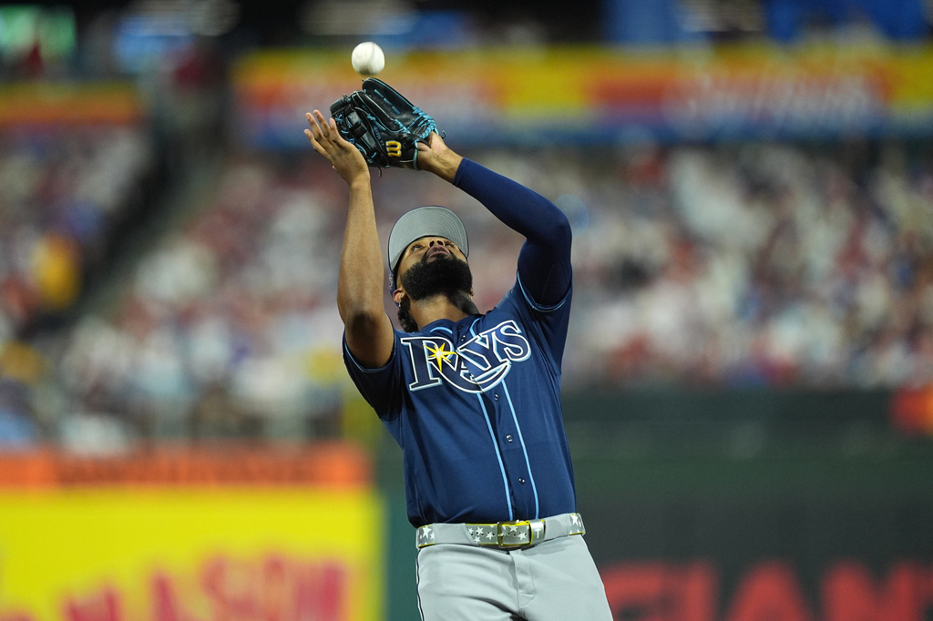 Tampa Bay Rays' Junior Caminero catches a fly ball by Los Angeles Dodgers' Max Muncy in the second inning during the MLB baseball All-Star Game between the American League and National League, Tuesday, July 14, 2026, in Philadelphia. (AP Photo/Matt Rourke)