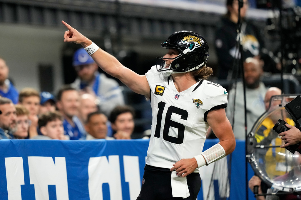 Jacksonville Jaguars quarterback Trevor Lawrence celebrates after scoring during the second half of an NFL football game against the Indianapolis Colts Sunday, Dec. 28, 2025, in Indianapolis. (AP Photo/Carolyn Kaster)