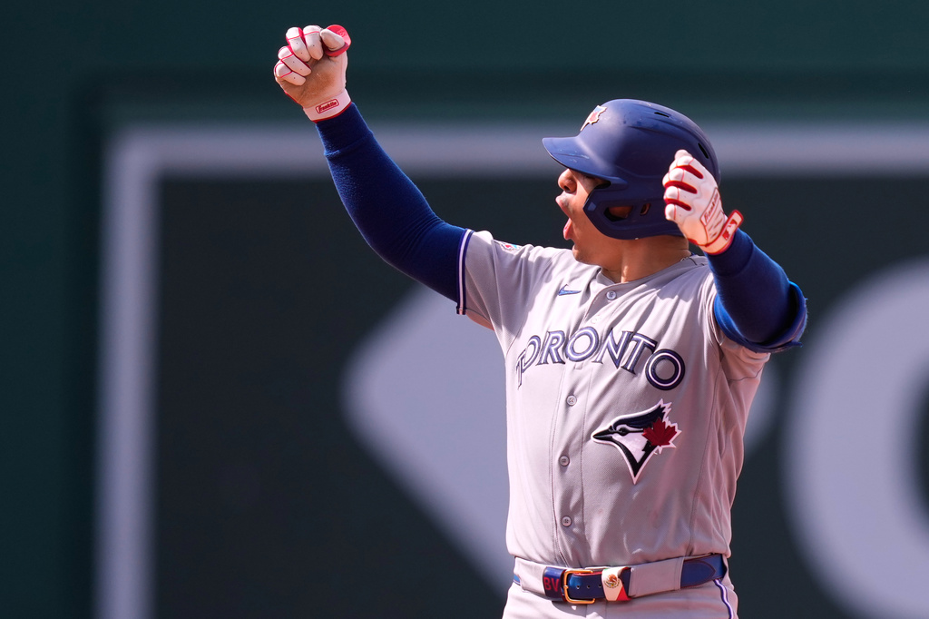 Toronto Blue Jays' Brandon Valenzuela celebrates after his RBI double, which broke a tie, during the ninth inning of a baseball game against the Boston Red Sox, Thursday, June 18, 2026, in Boston. (AP Photo/Charles Krupa)
