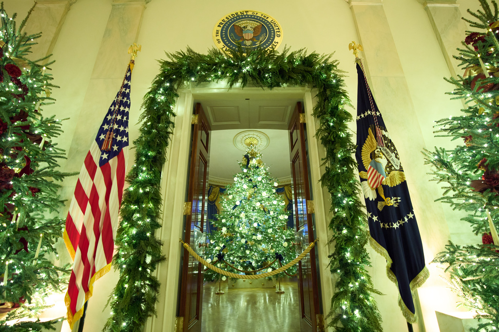 Christmas trees decorate the Cross Hall of the White House during a press preview of the Christmas decorations "Home is Where the Heart Is," Monday, Dec. 1, 2025, in Washington. (AP Photo/Evan Vucci)