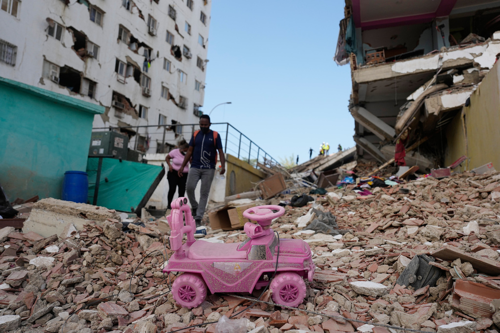 A toy car lies in the rubble two days after earthquakes struck Catia La Mar, Venezuela, Friday, June 26, 2026.(AP Photo/Fernando Vergara)