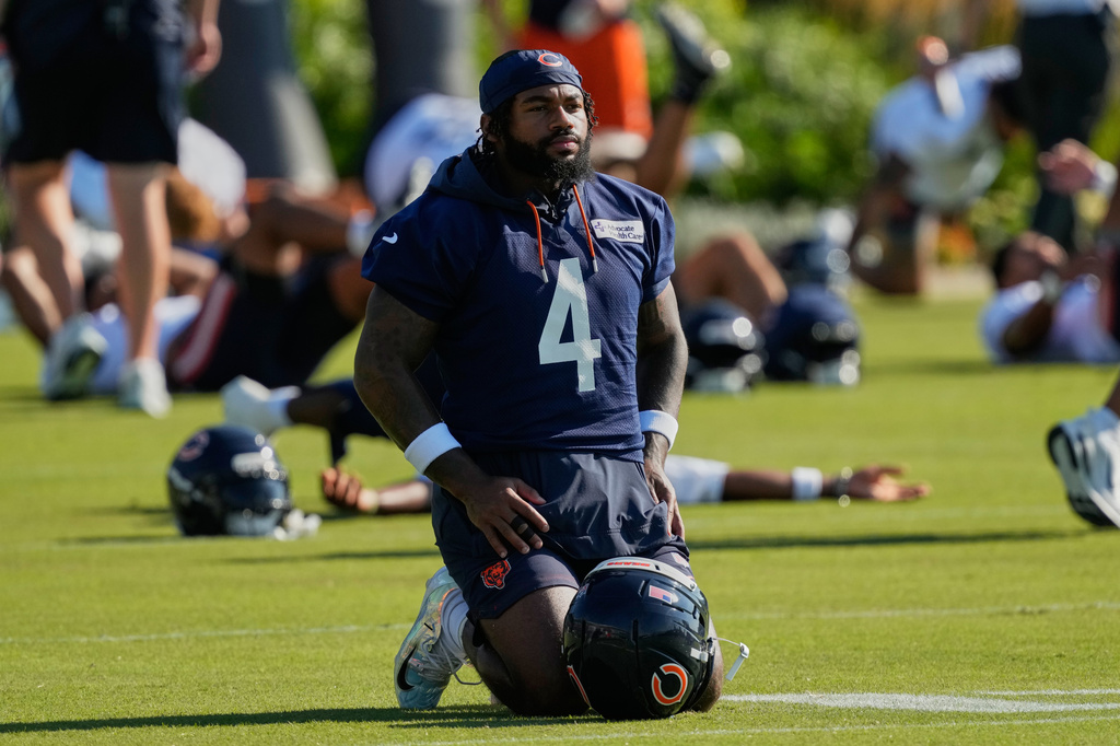 FILE - Chicago Bears running back D'Andre Swift warms up during practice at the team's NFL football training camp, Thursday, July 30, 2026, in Lake Forest, Ill. (AP Photo/Nam Y. Huh,File)
