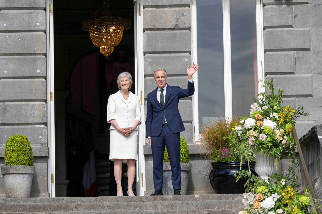 President of Ireland Catherine Connolly, left, and Canadian Prime Minister Mark Carney, right, during a visit to Westport House in Westport, Ireland, Sunday, June 14, 2026. (Andrew Downes/PA via AP)