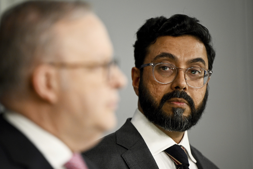 Special Envoy to Combat Islamophobia Aftab Malik watches as Australian Prime Minister Anthony Albanese speaks to the media during a press conference at the Commonwealth Parliamentary Offices in Sydney, Friday, Sept. 12, 2025. (Bianca De Marchi/AAP Image via AP)