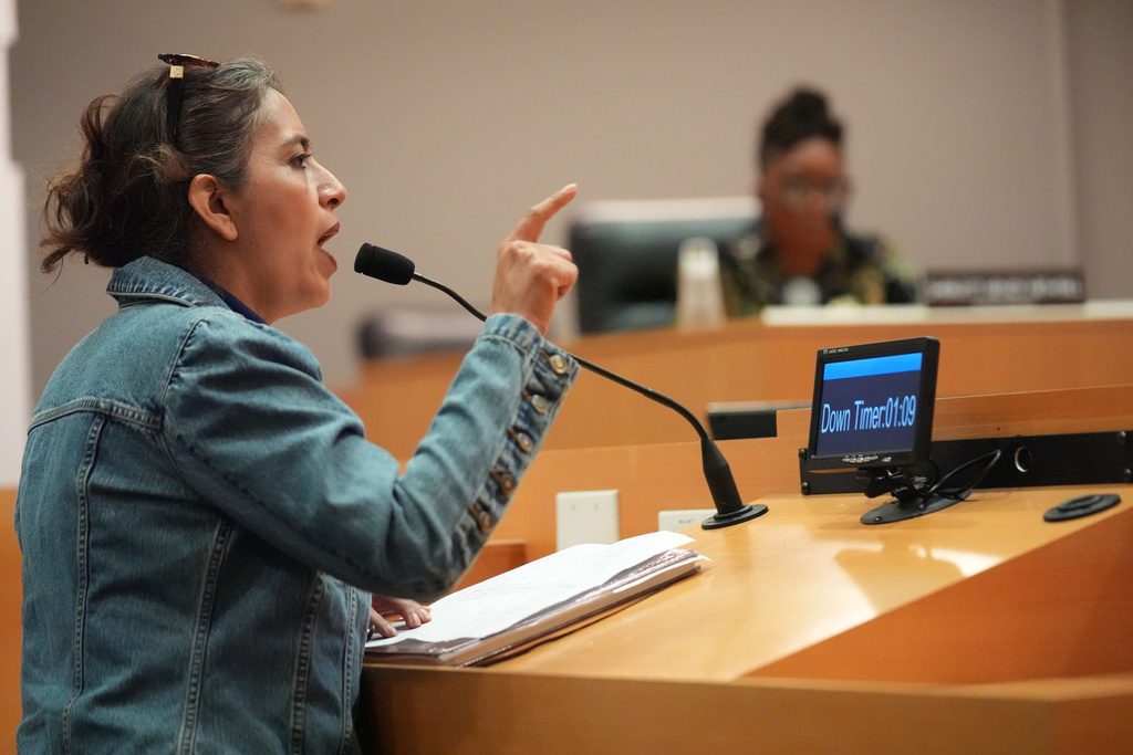 Parent Diana Guillen questions the Los Angeles Unified School District board members during public comments during a meeting at LAUSD headquarters before a special closed session with LAUSD Superintendent Alberto Carvalho, Thursday, Feb. 26, 2026, in Los Angeles. (AP Photo/Damian Dovarganes)