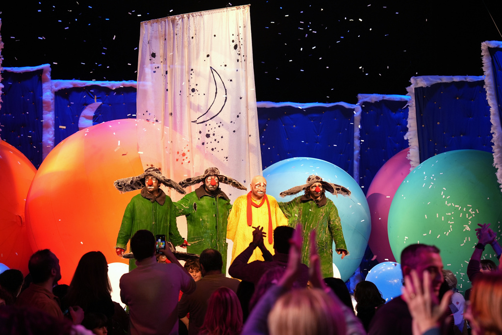 Russian clown and artist Slava Polunin and performers of his show appear onstage during “Slava’s Snowshow” at Teatro Strehler, on the sidelines of the 2026 Winter Olympics, in Milan, Italy, Friday, Feb. 6, 2026. (AP Photo/María Teresa Hernández)