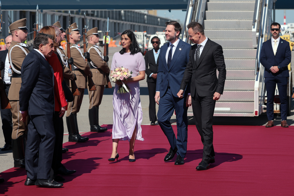 Hungarian Foreign Minister Peter Szijjarto, right, welcomes U.S. Vice President JD Vance, center, and second lady Usha Vance as they arrive at Budapest Ferenc Liszt International Airport in Budapest, Hungary Tuesday, April 7, 2026. (Jonathan Ernst/Pool Photo via AP)