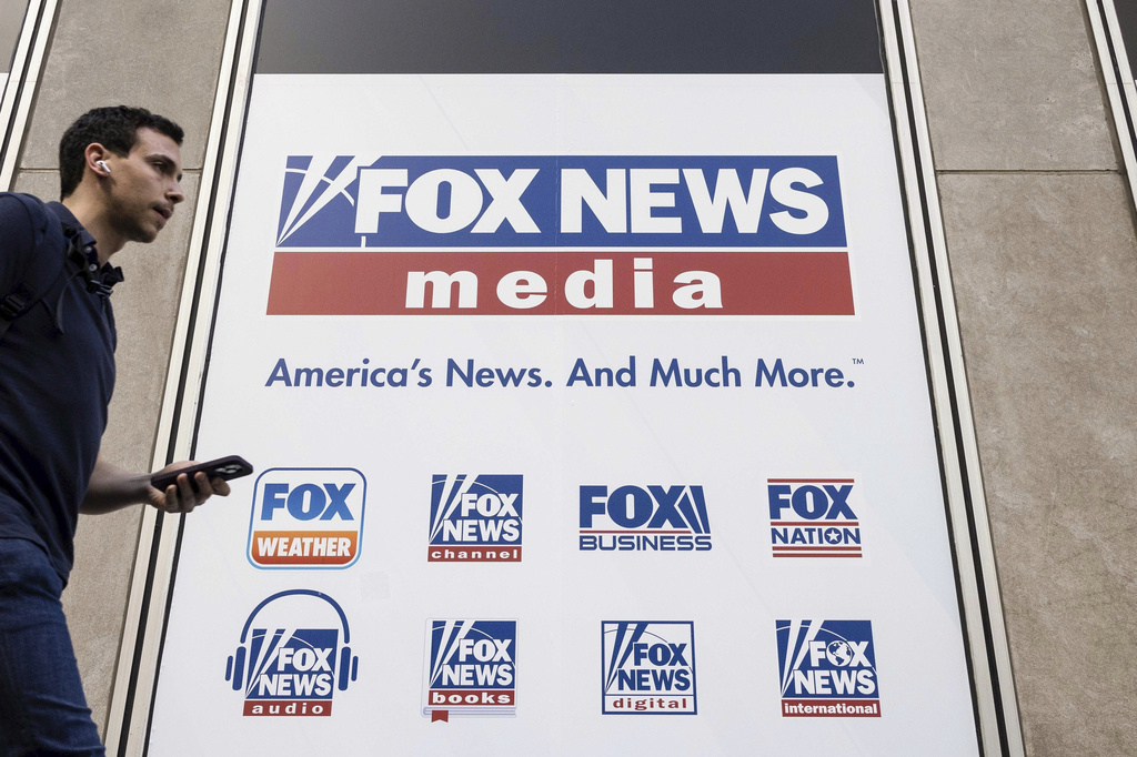 FILE - A person walks past the Fox News Headquarters in New York on April 12, 2023. (AP Photo/Yuki Iwamura, File)