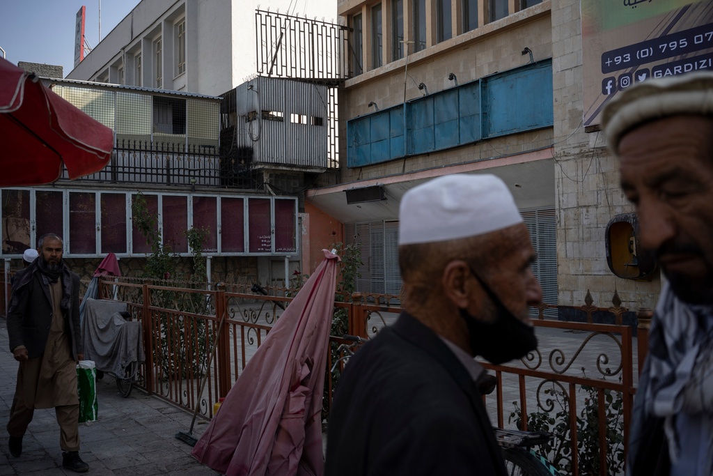 FILE - Empty billboards that used to display posters of Bollywood movies and American action flicks hang outside the Ariana Cinema in Kabul, Afghanistan, Monday, Nov. 8, 2021, before the cinema was demolished in December 2025 by Taliban authorities to make way for a new shopping center. (AP Photo/Bram Janssen, File)