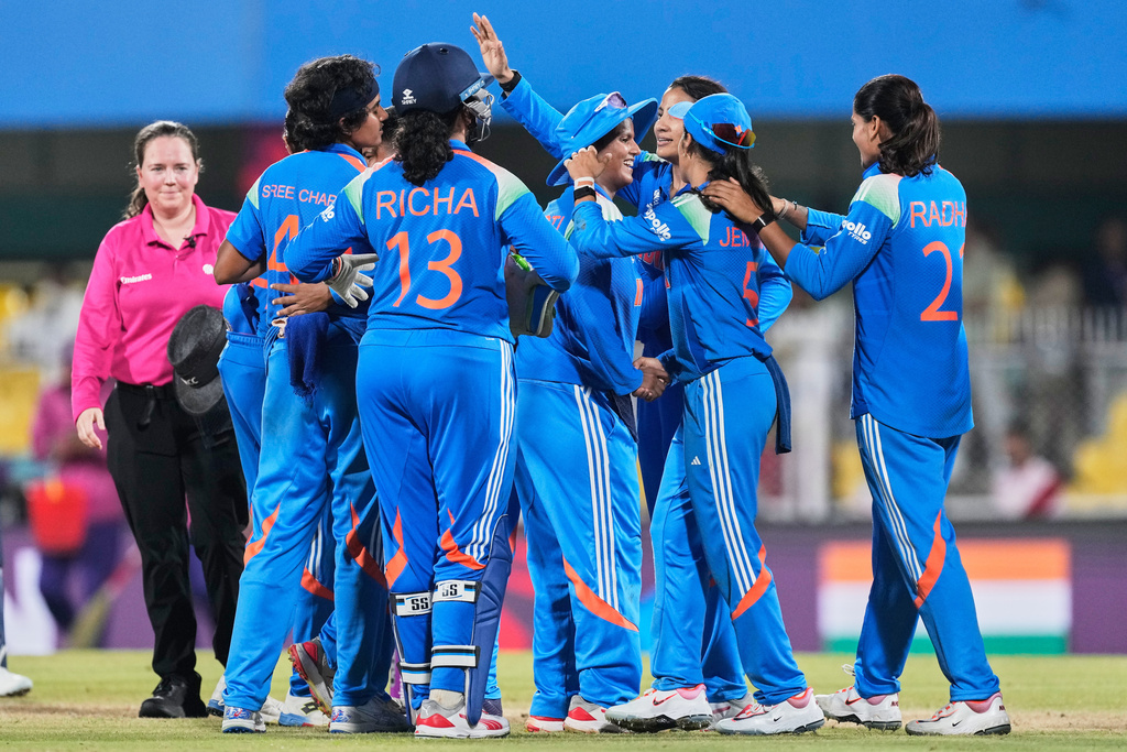 India's players celebrate after winning the ICC Women's Cricket World Cup match between India and Sri Lanka at Barsapara Cricket Stadium in Guwahati, India, Tuesday, Sept. 30, 2025. (AP Photo/Anupam Nath)