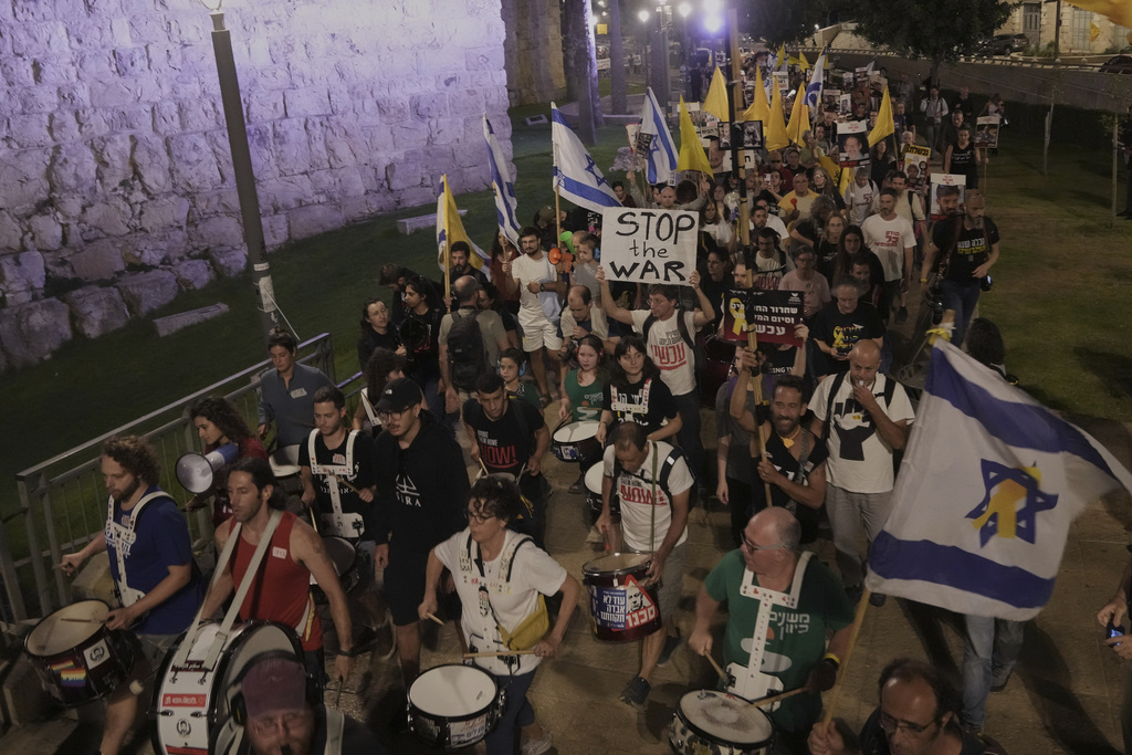 Relatives and supporters of Israeli hostages held in the Gaza Strip take part in a protest demanding their release from Hamas captivity and calling for an end to the war, outside the Old City of Jerusalem, Saturday, Sept. 20, 2025. (AP Photo/Mahmoud Illean)