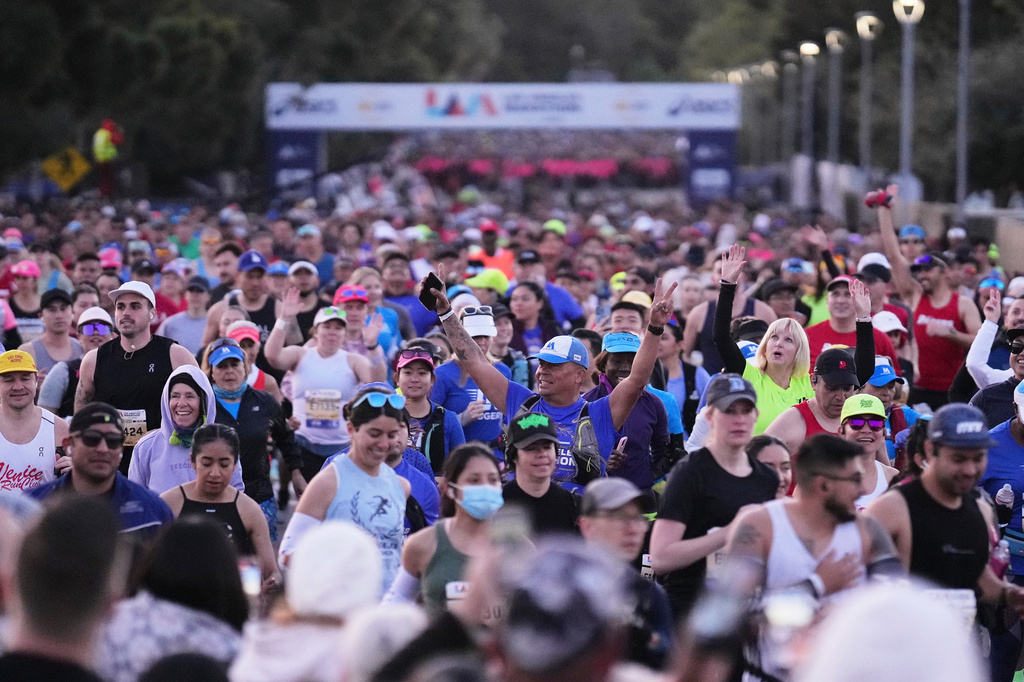 FILE - Participants prepare for the start of the Los Angeles Marathon, March 16, 2025, in Los Angeles. (AP Photo/Eric Thayer, File)