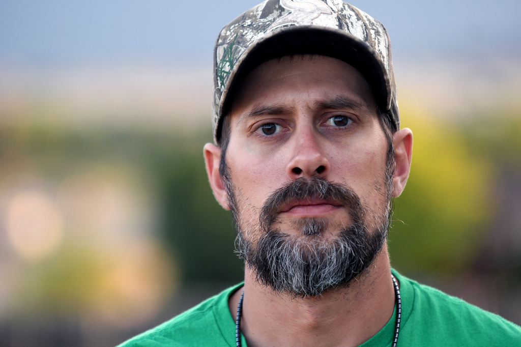 Jeremy Morrison, who says he was sent home with the wrong parents after he was born, poses for a portrait outside his home in Colorado City, Colo., Thursday, July 16, 2026. (AP Photo/Thomas Peipert)