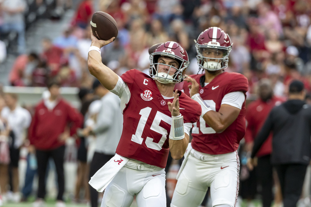 Alabama quarterback Ty Simpson (15) warms up before an NCAA college football game against Louisiana-Monroe, Saturday, Sept. 6, 2025, in Tuscaloosa, Ala. Alabama quarterback Keelon Russell (12) is seen in the background. (AP Photo/Vasha Hunt)