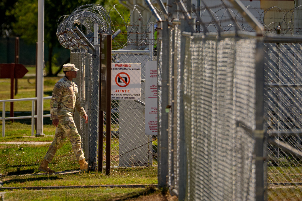 A U.S. serviceman enters a restricted area at the Mihail Kogalniceanu Air Base, in Mihail Kogalniceanu, Romania, Thursday, Sept. 10, 2026. (AP Photo/Andreea Alexandru)