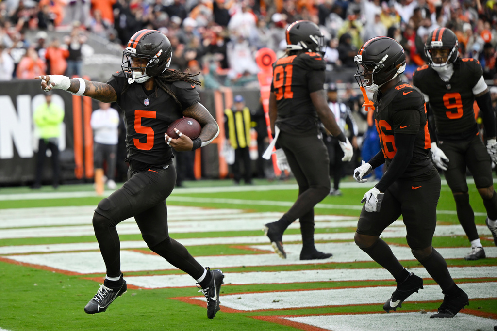 Cleveland Browns safety Rayshawn Jenkins (5) celebrates after intercepting a pass against the Miami Dolphins in the second half of an NFL football game in Cleveland, Sunday, Oct. 19, 2025. (AP Photo/David Richard)