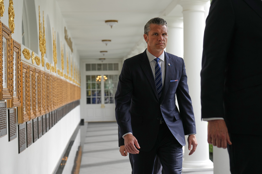 Defense Secretary Pete Hegseth walks along the Colonnade before President Donald Trump and China's President Xi Jinping at the White House, Thursday, Sept. 24, 2026, in Washington. (AP Photo/Jacquelyn Martin)